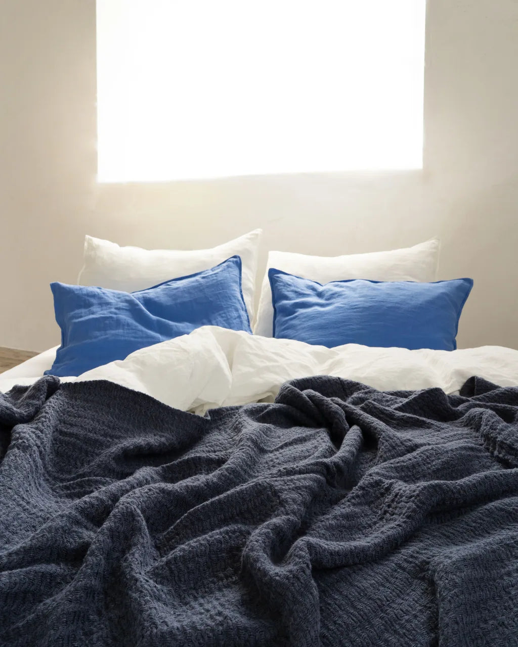 Close view of Vesta's woolly woven pure linen blanket in deep indigo